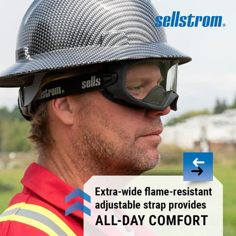 Person wearing Odyssey II Wildland Fire Goggles with hard hat, flame-resistant strap, and visible outdoor setting.
