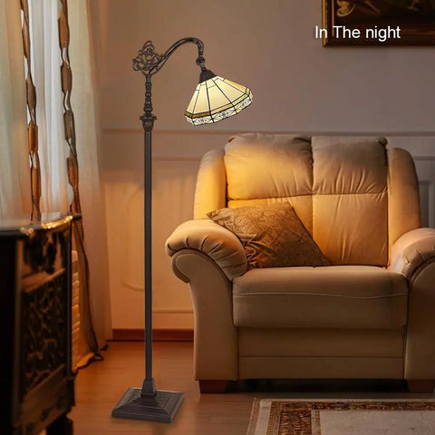 Tiffany Style Stained Glass Floor Lamp 62 Inch Tall With Adjustable Arched Shade Soft Warm Light Antique Cream Finish beside sofa