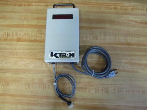 Heavy Hitter DMT Digital Readout Tester Featuring Knockout Five Digit Screen with plug play cables on a wooden surface.