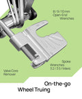 Close-up of All In One 20 In 1 Bike Repair Kit with valve core remover and spoke wrenches, perfect for wheel truing.