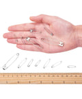 450 Pack Real Deal Iron Safety Clasp Pins For Crafting And Tailoring displayed in hand for size comparison with ruler.