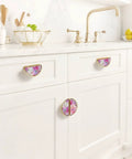 Pink Rose Hydrangea Cabinet Handles 2 Pack 3 Inch Center Hole Semicircle Gold Drawer Pulls installed on white cabinets.