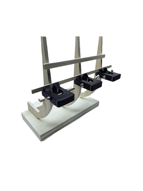 Pro Grade Model Ship Tools Combo Essential Toolkit for Wooden and Plastic Ship Models showing black clamps on a wooden base.
