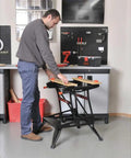 Man using Portable Work Bench With Vise And Adjustable Height Legs, Heavy Duty Steel Frame Supports Up To 450 Lbs