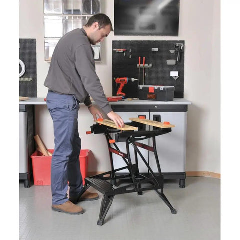 Man using Portable Work Bench With Vise And Adjustable Height Legs, Heavy Duty Steel Frame Supports Up To 450 Lbs