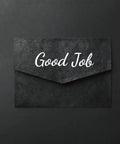 Black envelope with 'Good Job' text in white script lettering on its front