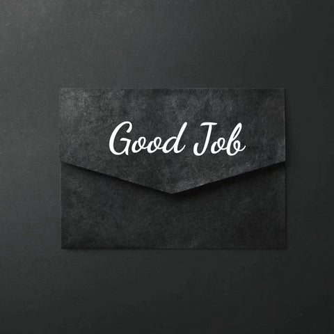 Black envelope with 'Good Job' text in white script lettering on its front