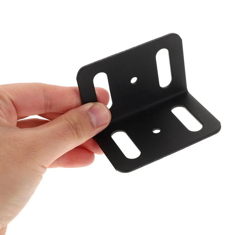 Hand holding Beefy Heavy Duty L Shape Iron Corner Bracket Set 4 Pieces Right Angle Shelf Braces For Wood Shelves And Bed Frames Versatile Metal Support Kit