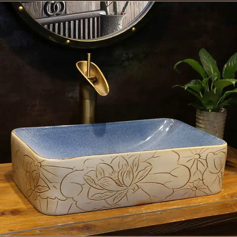 USZWBY Vessel Sinks Vessel Sink Lotus Pattern Art Countertop Basin Rectangular Ceramic Washbasin with blue interior top view.