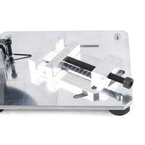 Portable Mini Table Saw Featuring Adjustable Zero To Forty Five Degree Angle Guide, aluminum clamping mechanism for precise cuts.