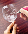 Person using Corded Electric Engraver Pen with Stepless Speed 3000 to 15000 RPM to etch design on glass