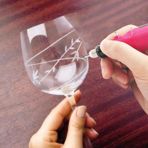 Person using Corded Electric Engraver Pen with Stepless Speed 3000 to 15000 RPM to etch design on glass