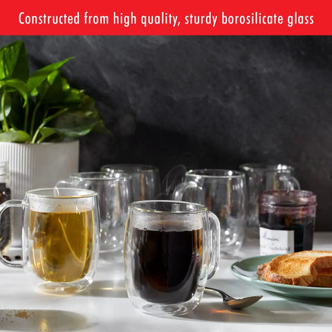 Four Piece Double Wall Insulated Glass Coffee Mug Set Keeps Hot Brews Steaming And Icy Drinks Frosty With Zero Sweat Marks Premium Borosilicate Glass Is Dishwasher Safe For Your Daily Grind Routine. Two mugs with hot drinks, sturdy borosilicate glass.