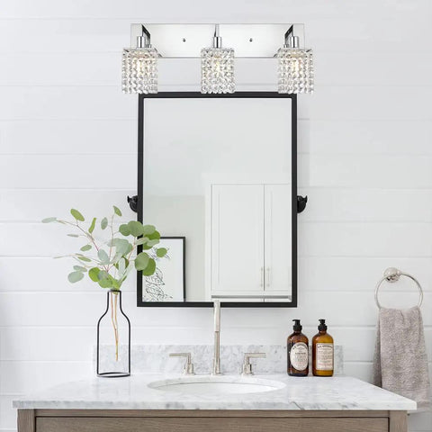 Three Light Crystal Vanity Light Fixture With Chrome Finish above bathroom mirror, modern crystal wall sconce lighting.