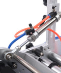 Close-up of the pneumatic cylinder and tubing on the Semi Automatic Round Bottle Labeling Machine High Speed 300W Fiber Optic Sensor.