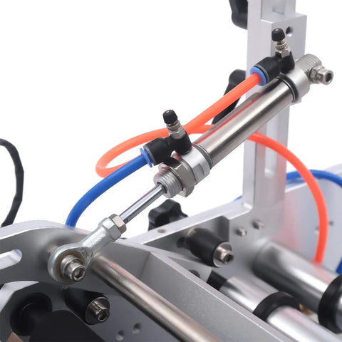 Close-up of the pneumatic cylinder and tubing on the Semi Automatic Round Bottle Labeling Machine High Speed 300W Fiber Optic Sensor.
