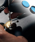 Watchmaker applying Pro Grade Watch Gasket Grease Silicone Lubricant For O-Rings And Case Backs with tools, blue grease shown