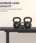 Heavy Load Electric Standing Desk Built Different For The Daily Grind, Super Silent Motor Lift Tech, Generous 55 By 28 Inch Sit Stand Workstation For Cozy Home Office And Pro Gaming Rig with kettlebells on top.