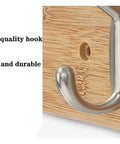 Close-up of a heavy duty hook from the Slick Wall Mount Coat Rack With Heavy Duty Hook Rails For Entryway And Mudroom Hang Your Duds Gear And Bags Without A Hitch Rustic Wood And Zinc Alloy Storage Solution.