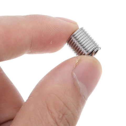 Close-up of a stainless steel insert from Pro Grade M8 Stainless Steel Thread Insert Kit With 10 Pieces For Easy Thread Repair