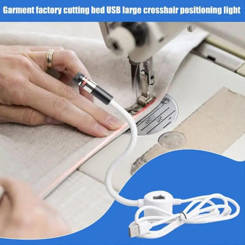 Plug And Play USB Laser Alignment Light With Slick Magnetic Mount For Sewing And Craft Cutting Delivering Crisp Red Cross Lines in use on fabric.