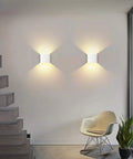 Dimmable Wall Sconce Set Of 2 Plug In LED Wall Lamps 12W Acrylic Modern Lighting illuminating a living room wall with warm glow