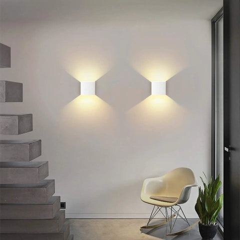 Dimmable Wall Sconce Set Of 2 Plug In LED Wall Lamps 12W Acrylic Modern Lighting illuminating a living room wall with warm glow