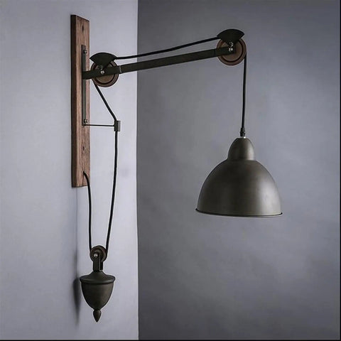Badass Industrial Pulley Wall Sconce Featuring Solid Black Iron Rope Lighting with adjustable height and vintage design.