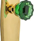 Prairie Plate Passage Crystal Emerald Glass Door Knob In Unlaquered Brass With Two And Three Quarters Backset, solid brass plate visible