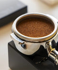 Solid Kickass Coffee Tamping Station With Integrated Espresso Scale Base And Grippy Silicone Portafilter Rest For Quicker Ground Coffee Weighing with tamped coffee.