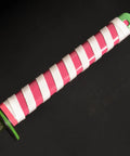 Close-up of Iguro Obanai Demon Slayer Katana handle, wrapped in pink and white wax rope for safe grip, part of real metal sword prop.