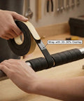 Person applying Pipe Wrap Insulation Tape For Hot And Cold Pipes Waterproof Foam Adhesive 33 Feet Long And 2 Inches Wide One Eighth Inch Thick Prevents Condensation And Freezing For Diy Home Plumbing Projects to metal pipe