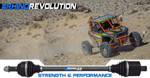 Off-road vehicle with Beefed Up Rhino 2.0 Heavy Duty Rear Axles For Polaris RZR, 4340 Chromoly Steel, desert terrain