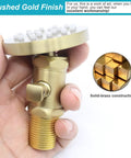 Hand holding solid brass shower body jet with adjustable flow, high pressure massage round spa spray jet, brushed gold finish.