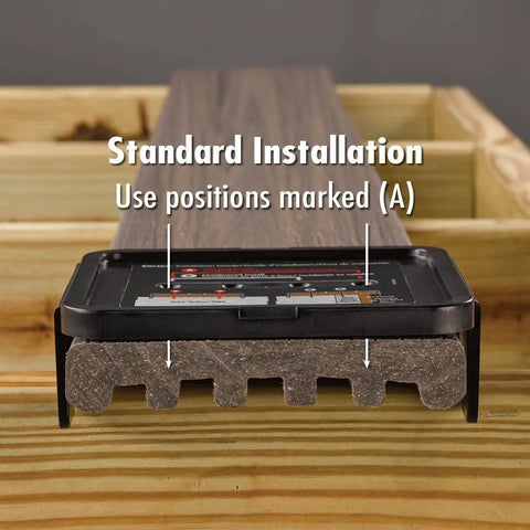 Close-up of hidden deck screws for Trex Enhance installation showing a standard installation guide on a Rocky Harbor plank.