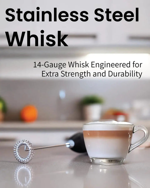 Elementi Handheld Electric Drink Mixer Wand With High Speed Motor For Frothing Milk Blending Protein Shakes And Whisking Cocktails. Easy To Use Mini Frother Stick For Coffee, Tea, And Creamy Lattes In Burgundy Color. Durable Battery Operated Design For, beside a frothy latte.