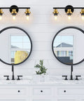Three Light Bathroom Vanity Light With Clear Globe Shade, Black And Brass Modern Wall Sconces Over Mirror in bathroom setting