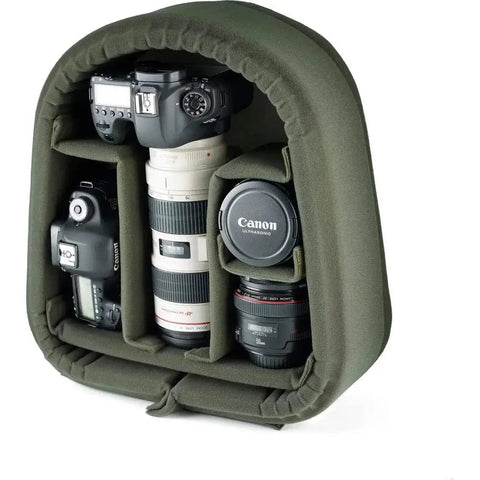 Rucksack 25 Camera Bag For DSLR Gear With Tablet Pocket displaying padded dividers with lens and camera storage in sage FibreNyte.