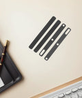 Set Of Four Premium Keyboard Soundproof Foam Space Bar Acoustic Cushion Quiet The Daily Clack For PC Gamers And Streamers Easy Install Silent Dampening Pad displayed on beige desk.