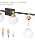 Four Light Mid Century Modern Bathroom Vanity Light Fixtures Over Mirror In Black And Gold With Milk White Glass Globes Wall Mount