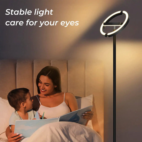 Room scene with a Led Floor Lamp With Rotatable Saturn Ring Design Stepless Dimming From 3000K To 6000K lighting a mother and child reading.