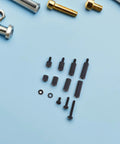 Black Hex Nylon Standoffs M3 Hardware Kit With Screws And Nuts Perfect For Circuit Boards Electronics Projects Organized Assortment Fasteners black nylon spacers on blue background