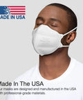 Person wearing NIOSH Certified N95 Particulate Respirator Mask Pack of 30 Made in USA with dual headbands and nose clip