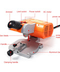 Solid 2 Inch Mini Benchtop Miter Saw with aluminum base, power switches and saw blade shown for clean crosscuts up to 45 degrees.
