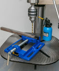 4 Inch Drill Press Vise For Your Home Shop Portable Bench Vise clamping metal, showing rugged cast iron build on drill press