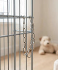Chain Link Gate Latch with Double Carabiner Ends Stainless Steel hanging on a metal fence, showcasing durable construction.