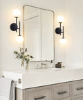 Two Light Modern Matte Black Vanity Lights With White Globe Glass Shades Industrial Farmhouse Wall Lamp in bathroom setting