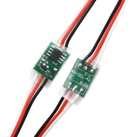 Front view of two 3-wire servo delay modules for steering gears with red, black, and white leads