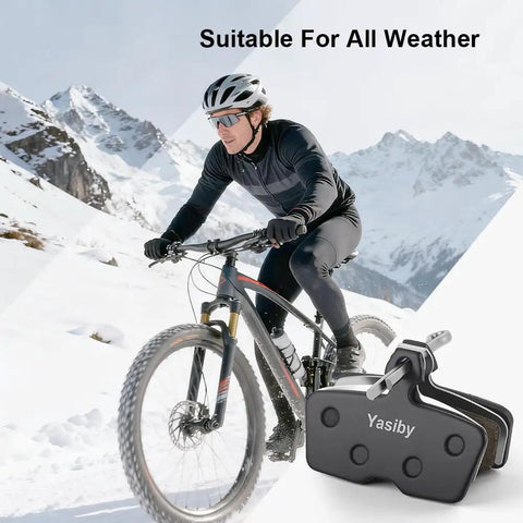 Pro Grade Mountain Bike Disc Brake Pads Set With Installation Tools Four Pairs Semi Metallic And Organic Resin Pads For AVID SRAM Code R RE RSC Guide RE G2 RE DB8, Quieter Braking Stops On A Dime Durable And Heat Resistant shown with cyclist in snowy mountains