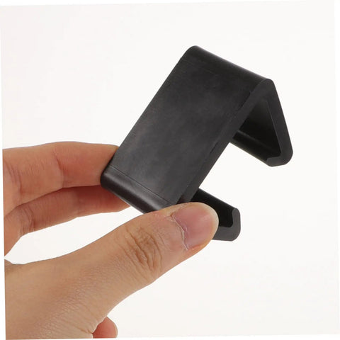 Hand holding one clip from 12 Pack Outdoor Furniture Clips For Patio Sofas And Rattan Chairs, Lightweight Quick Install Clamps That Prevent Movement